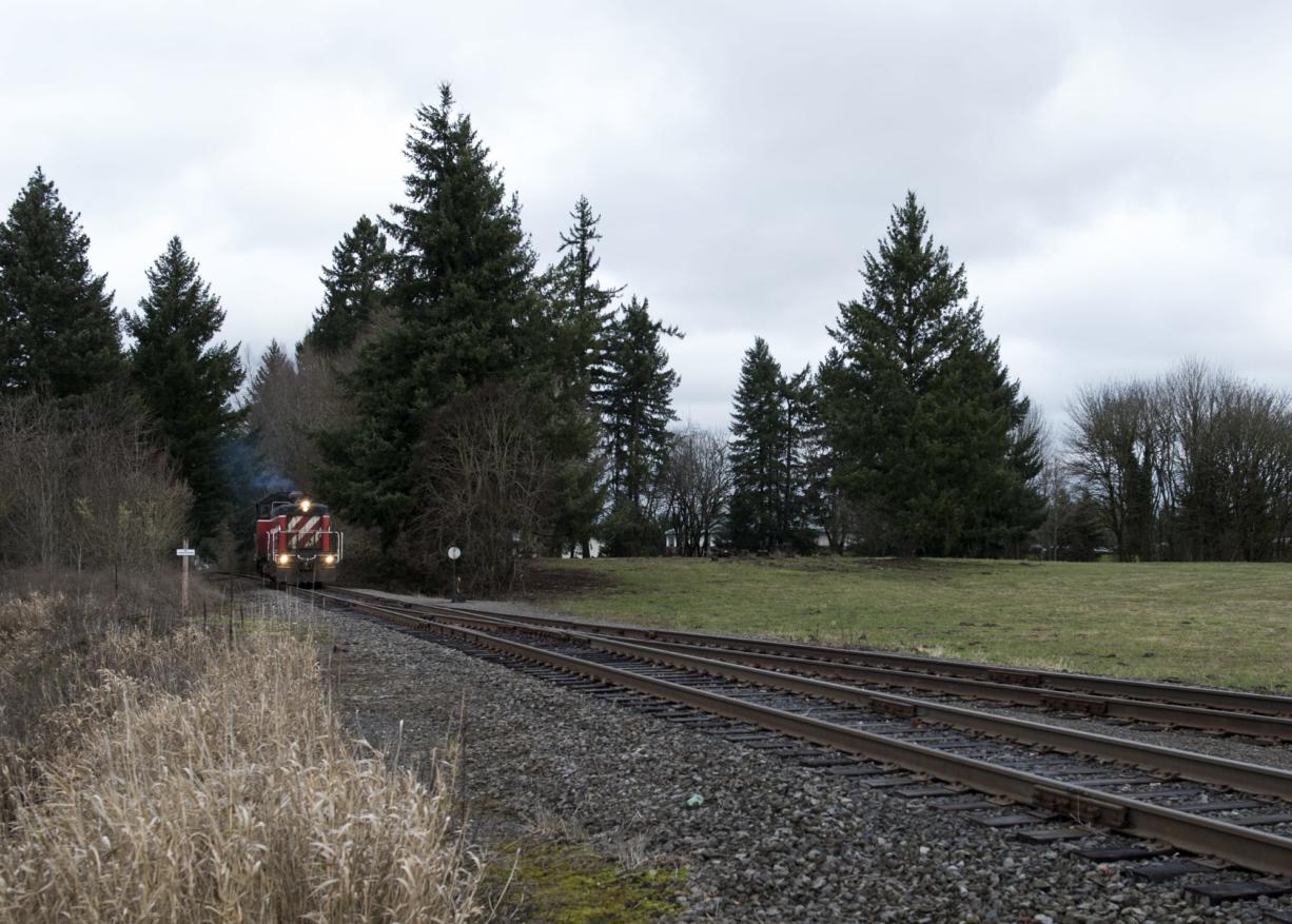 A locomotive with Portland Vancouver Junction Railroad moves toward the intersection of Northeasr St. Johns Road and 78th Street in January 2018.