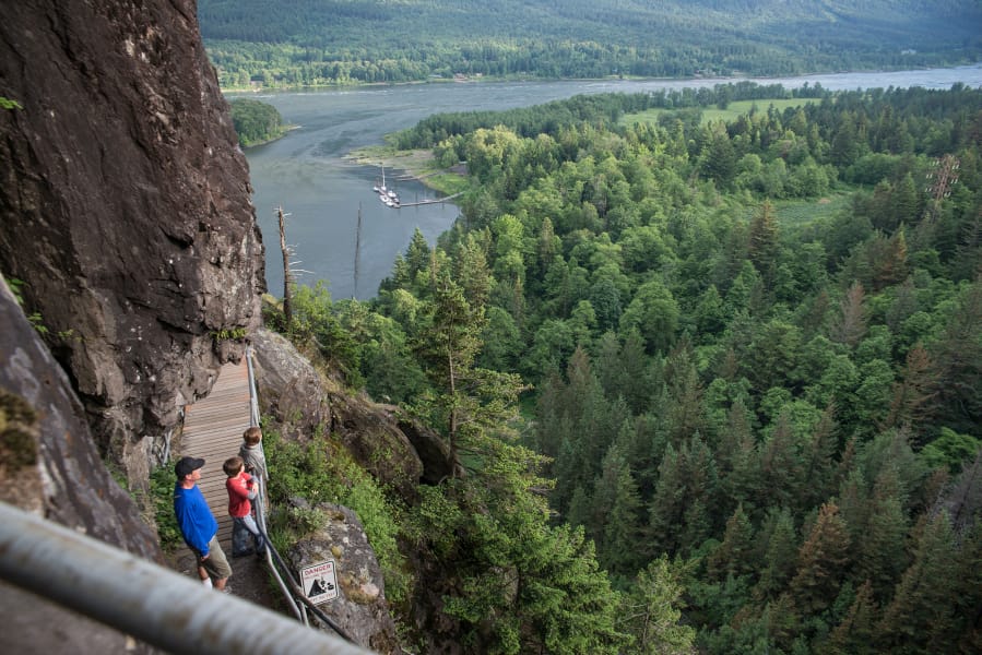 Hikers ascend the century-old stairway trail at Beacon Rock State Park.