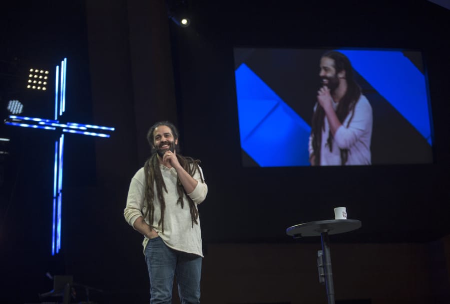 The Rev. Daniel Fusco, lead pastor at Crossroads Community Church, talks about Jesus during an Easter Sunday service. The Vancouver megachurch’s services, which are recorded and streamed live online, are viewed by people around the world.