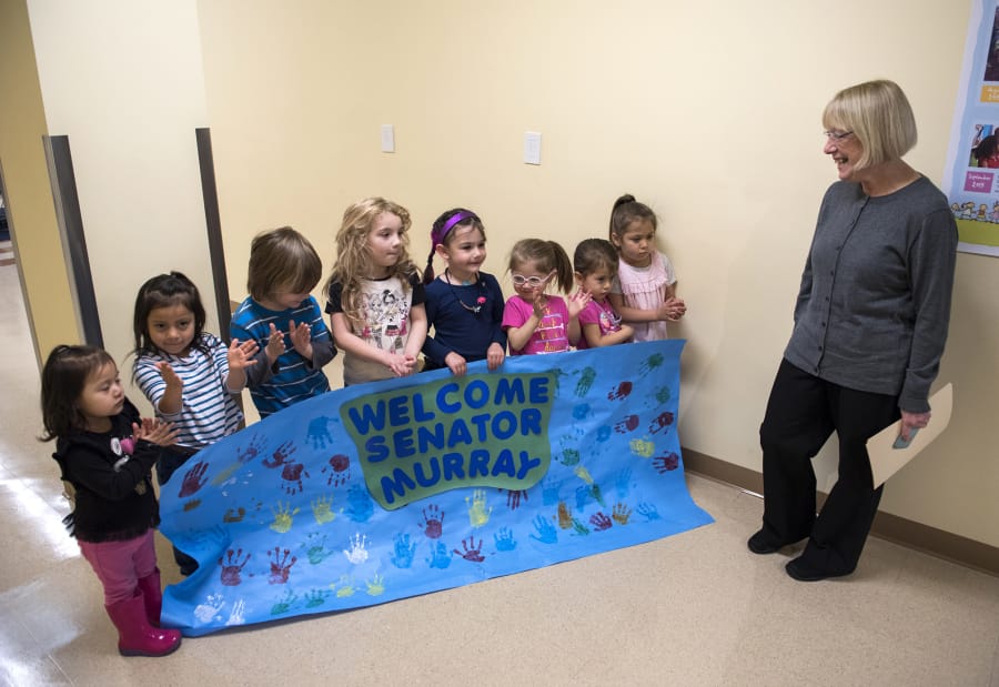 Students from Hough Early Learning Center in Vancouver greet Sen. Patty Murray on Wednesday as she arrives at the center.