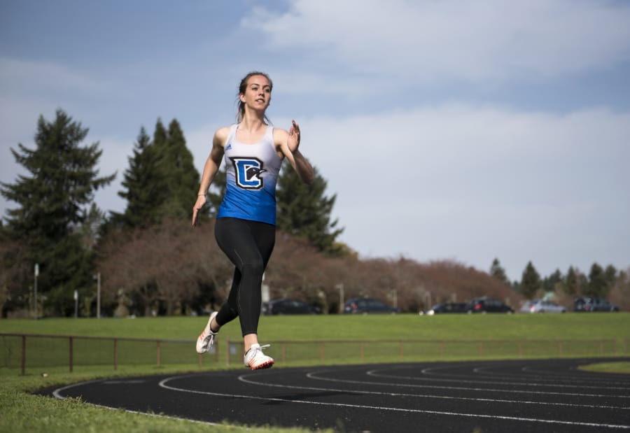 Chloe Lindbo, a Ridgefield High School graduate and Clark College sophomore, is pictured during practice in Vancouver Monday morning, April 9, 2018. Lindbo specializes in the heptathlon, a seven-event specialty that includes the 100-meter hurdles, high jump, shot put, the 200-meter race, long jump, javelin and the 800-meter run.