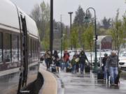 Passengers exit an Amtrak train at the Amtrak Train Station in Vancouver, Thursday afternoon, April 5, 2018.