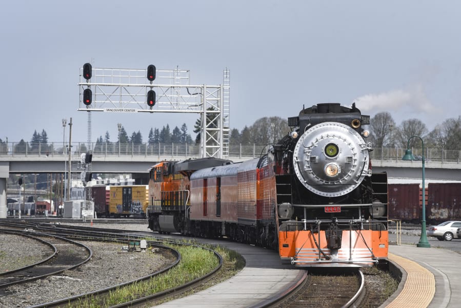 The Southern Pacific 4449 steam locomotive passes through the Vancouver Amtrak station at midday Monday. It will be in Vancouver and the Columbia River Gorge for a few days for a video shoot.