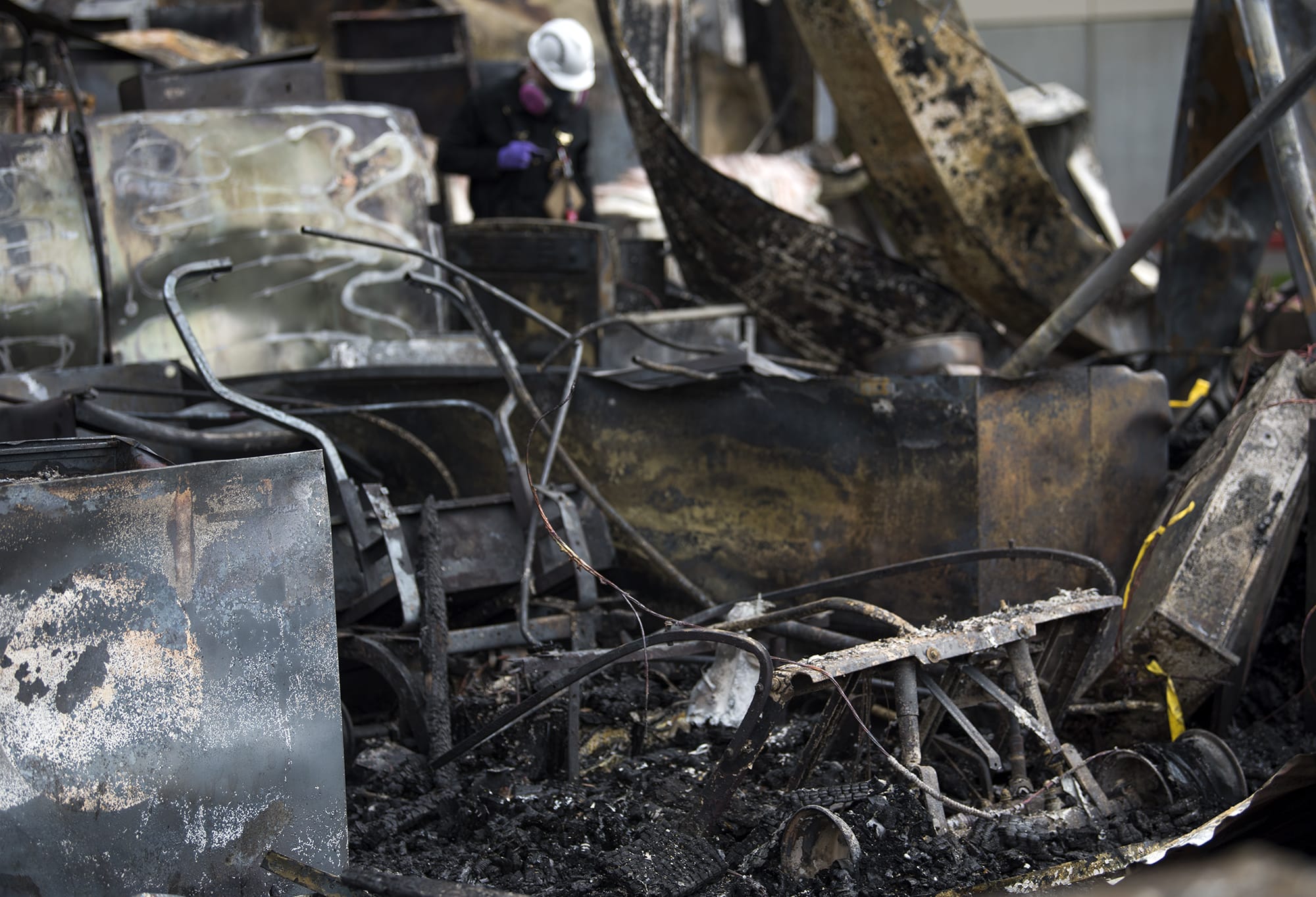 Clark County fire officials investigate the scene of a fire at the Malt Shop and Grill and the Chicken and Rib House booths at the Clark County Event Center at the Fairgrounds on Wednesday morning, April 11, 2018. Betty and Larry Bowman run the two booths, and the remnants of their golf cart is visible in the burnt structure.