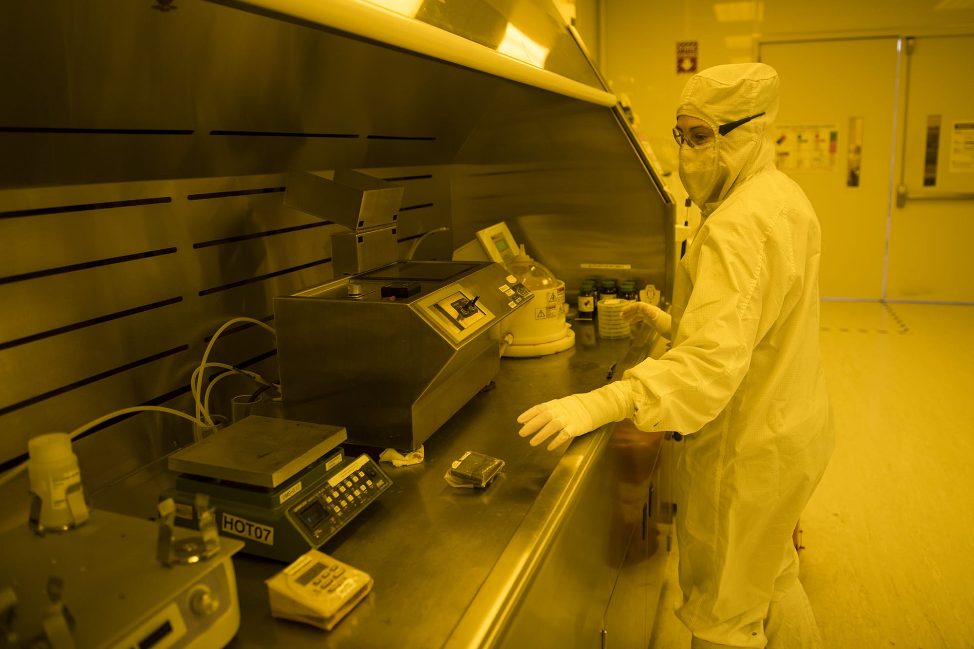 nLight worker Megan Stone applies photo resistance to wafers during the laser manufacturing process at its Vancouver headquarters. The company started trading at $16 per share and closed at $26.95.
