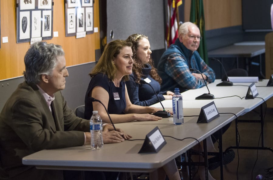 Candidates for Washington’s 3rd Congressional District from left, David McDevitt, Carolyn Long, Dorothy Gasque and Earl Bowerman considered gun legislation and mental health during a town hall organized by Students Demand Action Clark County.