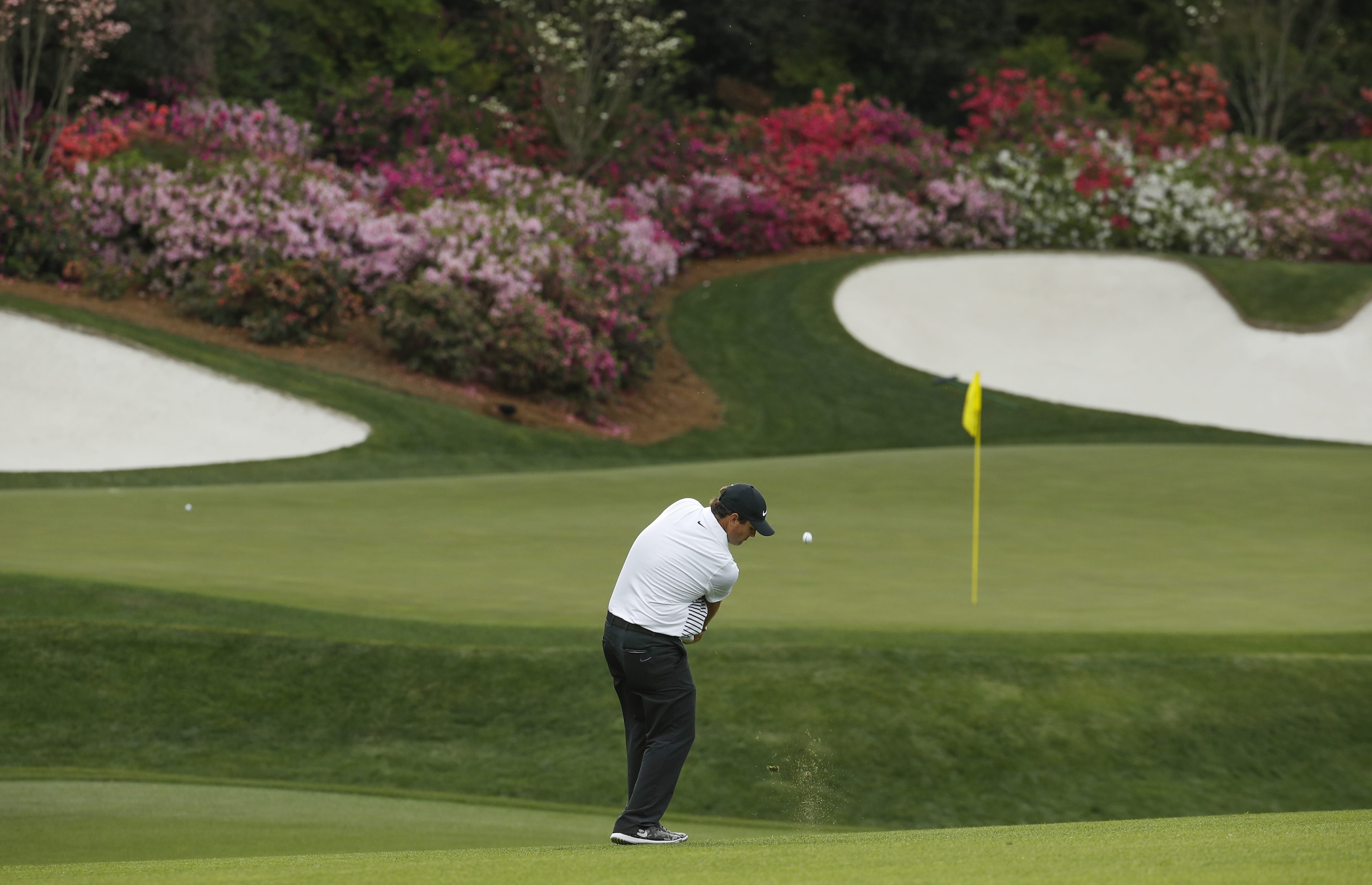 Patrick Reed hits to the 13th green during the second round at the Masters golf tournament Friday, April 6, 2018, in Augusta, Ga.