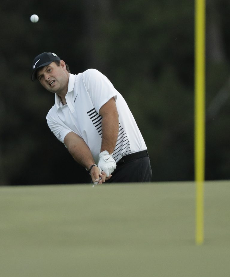 Patrick Reed chips to the 18th hole during the second round at the Masters golf tournament Friday, April 6, 2018, in Augusta, Ga. (AP Photo/David J.