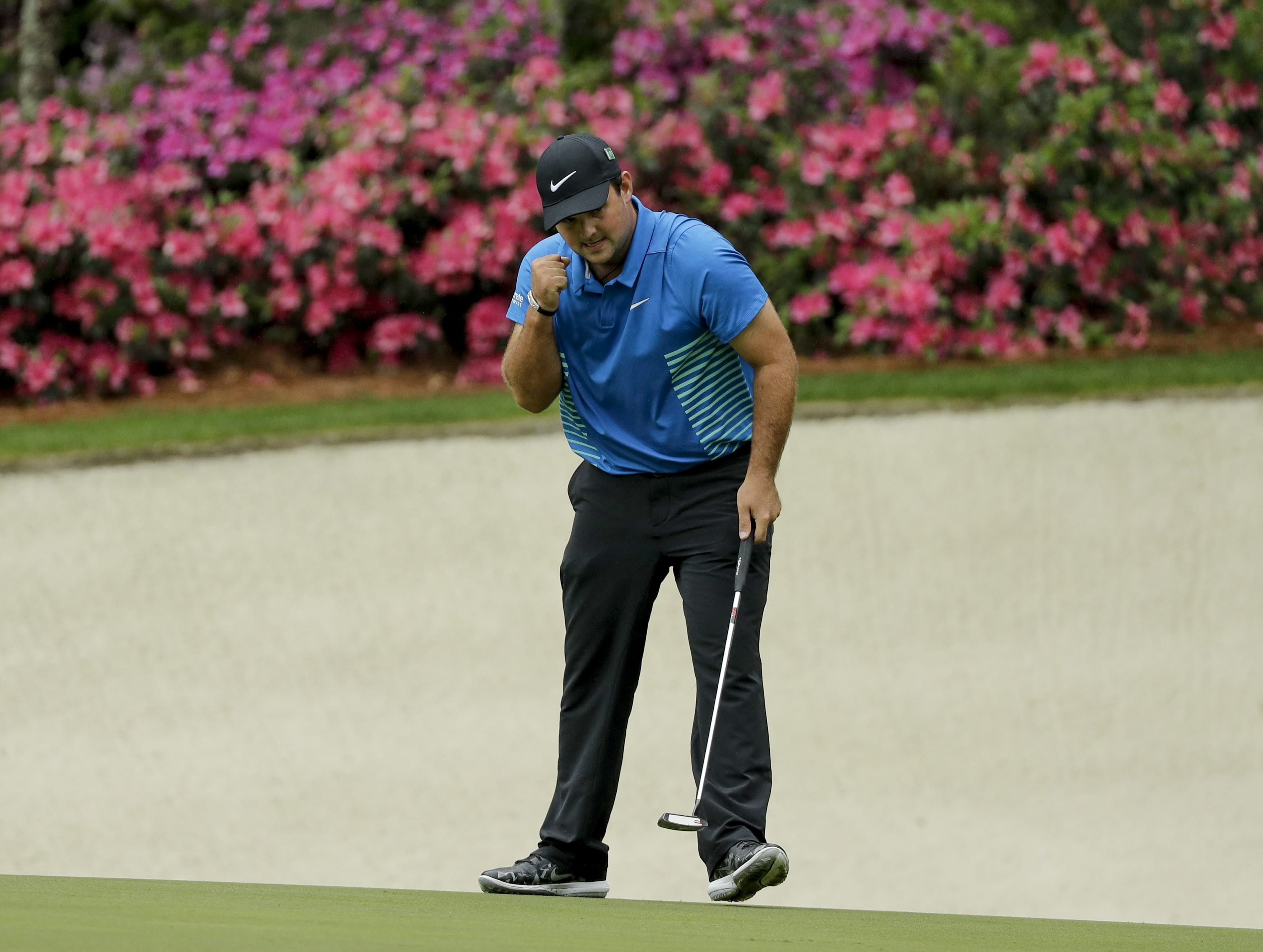 Patrick Reed reacts to his eagle on the 13th hole during the third round at the Masters golf tournament Saturday, April 7, 2018, in Augusta, Ga. (AP Photo/David J.