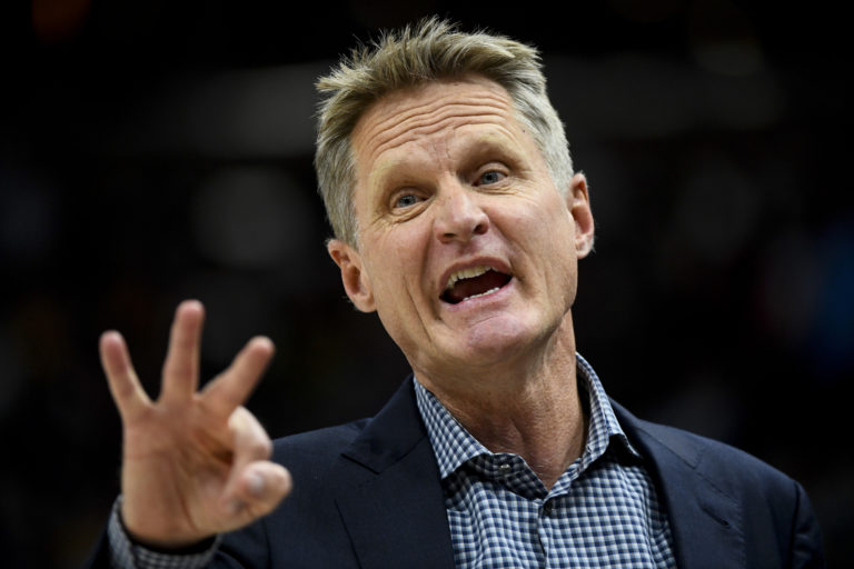 Golden State Warriors head coach Steve Kerr yells to his players in the first half of an NBA basketball game against the Utah Jazz Tuesday, April 10, 2018, in Salt Lake City.