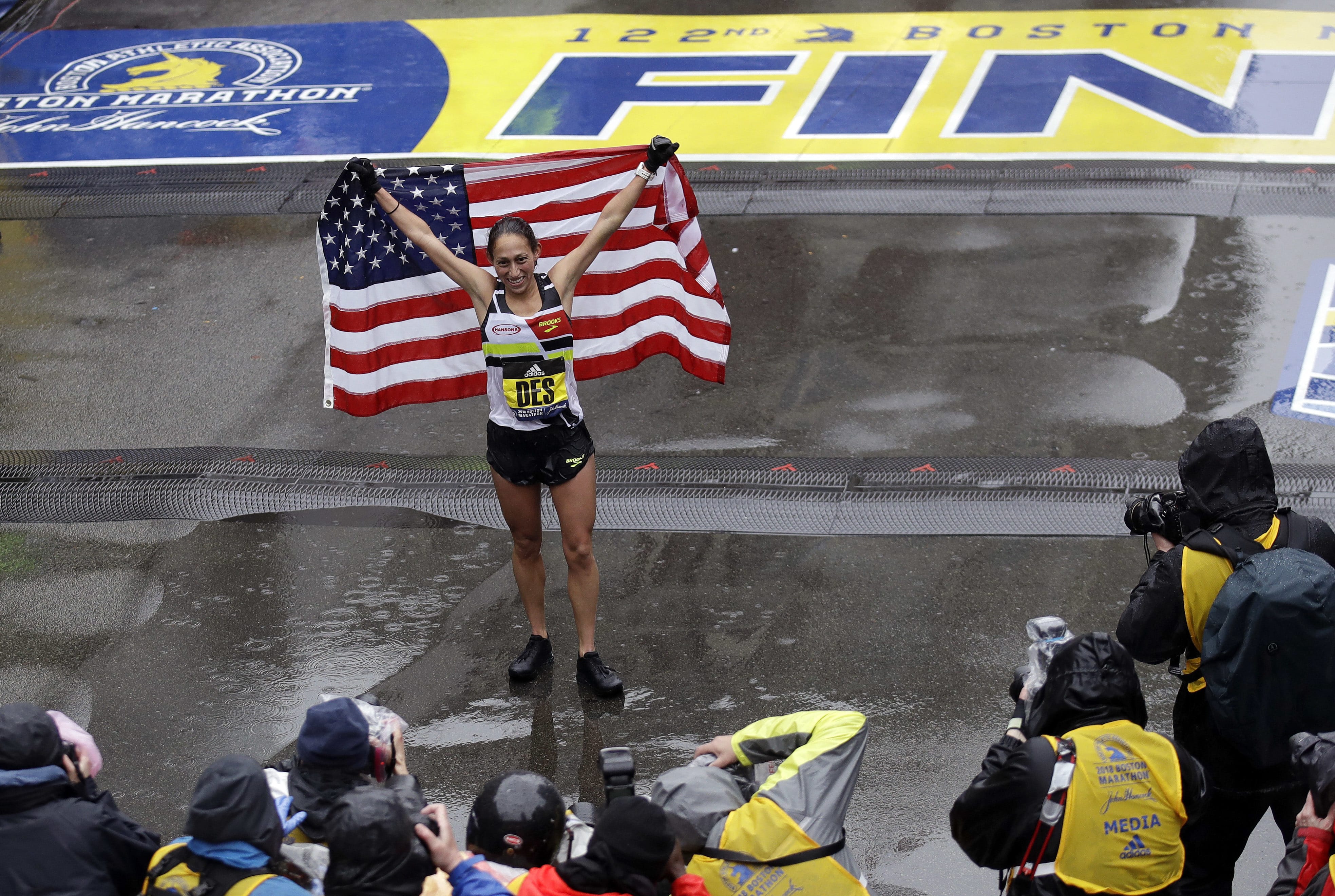 Desiree Linden, of Washington, Mich., celebrates after winning the women's division of the 122nd Boston Marathon on Monday, April 16, 2018, in Boston. She is the first American woman to win the race since 1985.