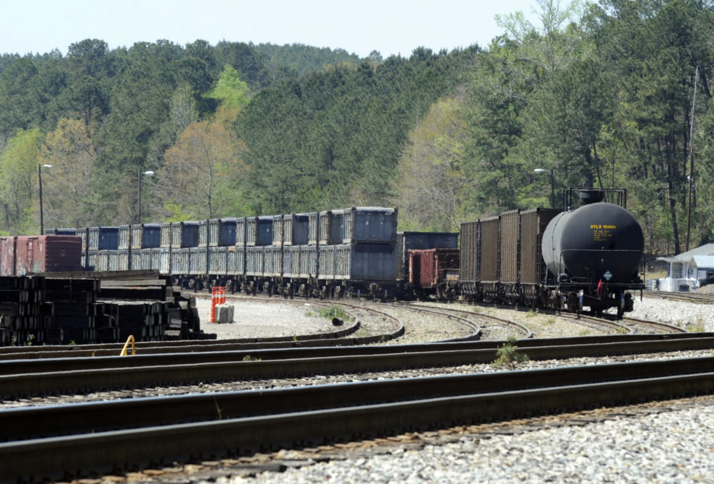 This April 12, 2018 photo shows containers that were loaded with tons of sewage sludge in Parrish, Ala. More than two months after the so-called "Poop Train" rolled in from New York City, Hall says her small town smells like rotting corpses. Some say the trainloads of New Yorkers' excrement is turning Alabama into a dumping ground for other states' waste.