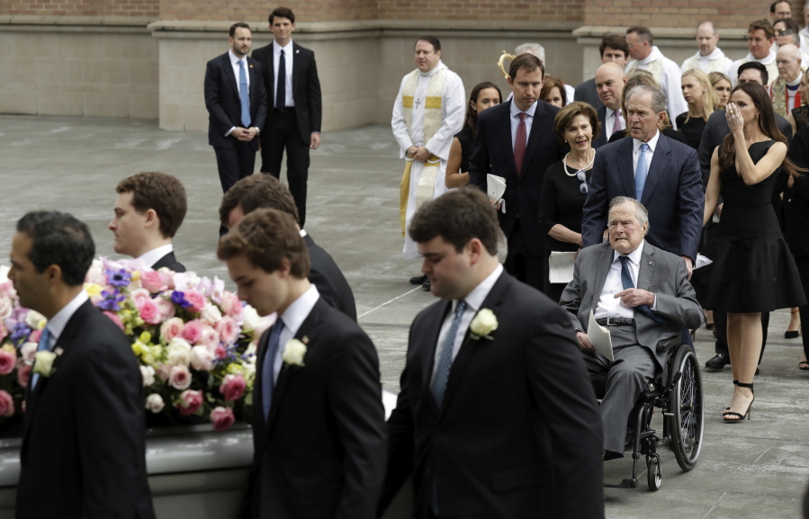 Former President George H.W. Bush and George W. Bush, followed by former first lady Laura Bush follow as pallbearers carry the casket of former first lady Barbara Bush after a funeral service at St. Martin's Episcopal Church, Saturday, April 21, 2018, in Houston.