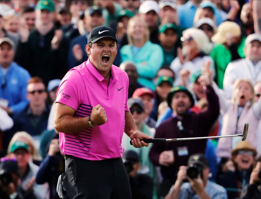 Patrick Reed celebrates after winning the Masters golf tournament Sunday, April 8, 2018, in Augusta, Ga.