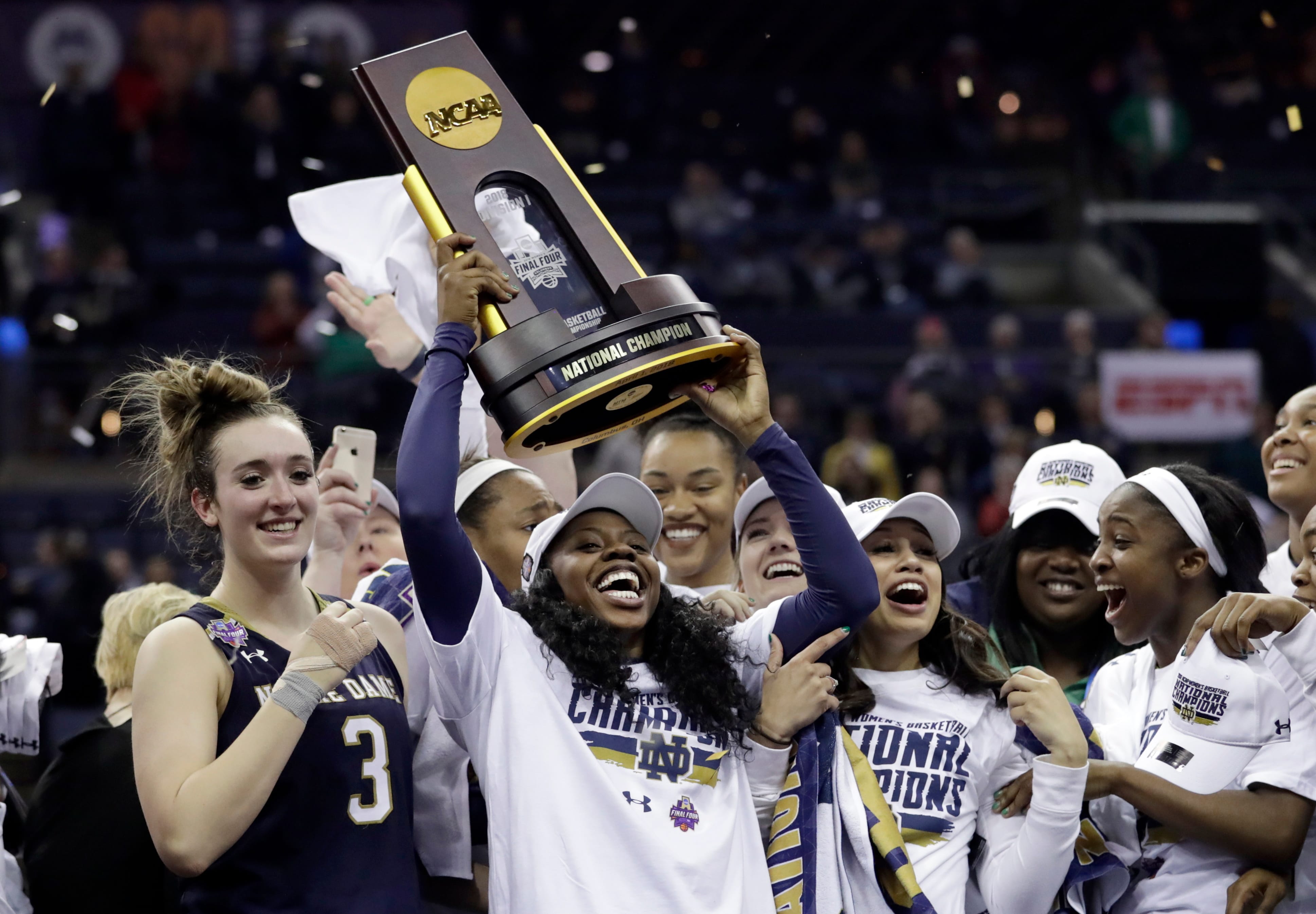 Notre Dame's Arike Ogunbowale holds the trophy after defeating Mississippi State in the final of the women's NCAA Final Four college basketball tournament, Sunday, April 1, 2018, in Columbus, Ohio. Notre Dame won 61-58.