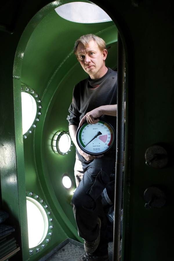 FILE - In this April 30, 2008 file photo, submarine owner Peter Madsen stands inside the vessel. One of the most talked-about and macabre court cases in recent Danish history is set to conclude Wednesday, April 25, 2018 when the verdict is handed down on whether Peter Madsen tortured and murdered a Swedish journalist during a private submarine trip.