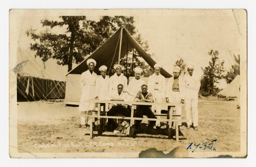 In a photo provided by the Bentley Historical Library, cooks of Free Soil Civilian Conservation Corps are photographed in 1935 in Michigan. The university has acquired a trove of photos capturing a place and time largely overlooked by history: black CCC camps during the Great Depression. The photos are the only known images of the state’s segregated, all-black camps. President Franklin Roosevelt established the corps in the early 1930s to employ a “vast army” of unemployed men and restore national resources.