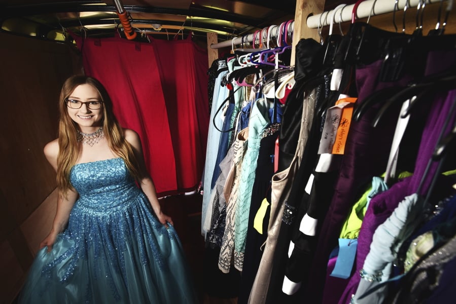In an April 25, 2018 photo, Weston-McEwen senior Christina Swafford, of Athena, Oregon, poses in the dress she won along with a $2000 scholarship and 100 prom dresses from the Portland charity Abby's Closet. Abby's Closet collects and redistributes used formal dresses to high school students in need. (E.J.