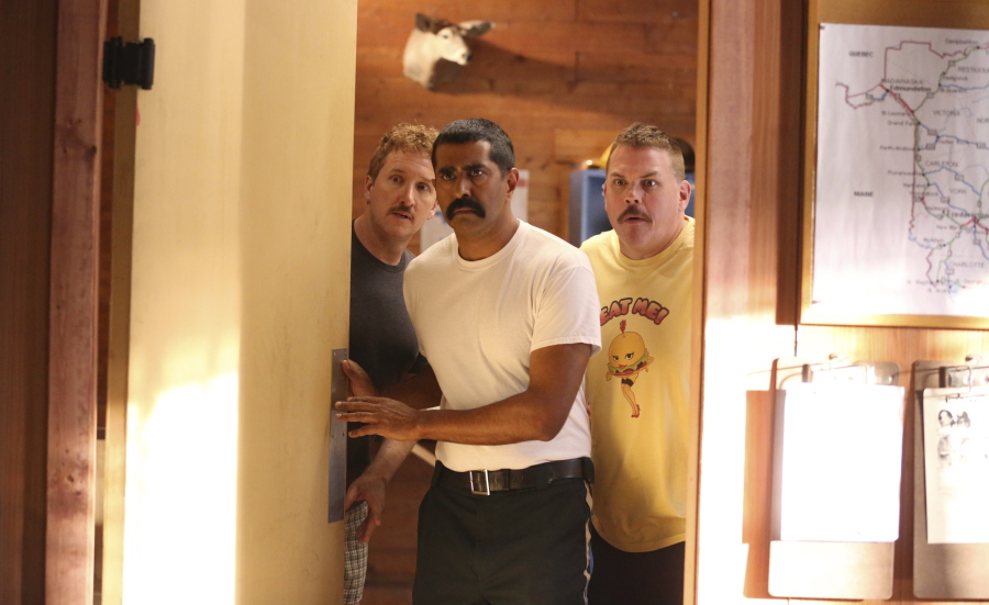 This image released by Fox Searchlight shows Paul Soter, from left, Jay Chandrasekhar and Kevin Heffernan in a scene from “Super Troopers 2.” (Jon Pack/Fox Searchlight via AP)