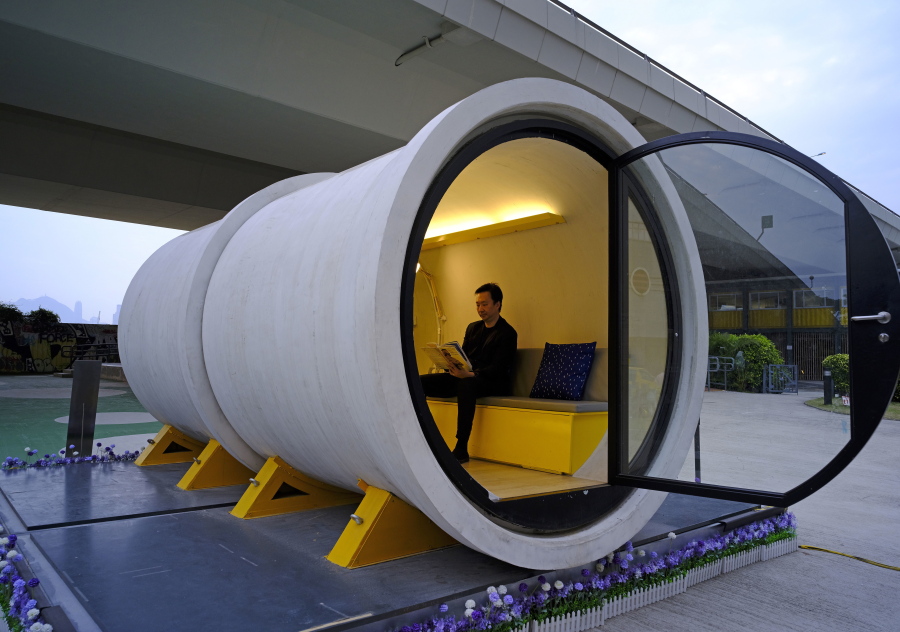 Architect James Law sits in an OPod tube house last month in Hong Kong’s industrial area of Kwun Tong.