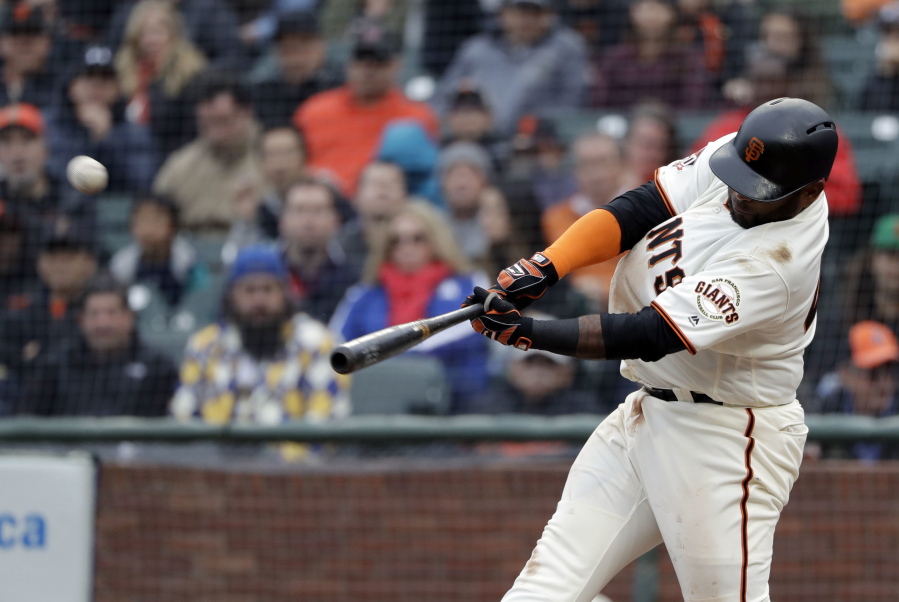 San Francisco Giants' Pablo Sandoval hits a three-run home run against the Seattle Mariners during the fifth inning of a baseball game Wednesday, April 4, 2018, in San Francisco.