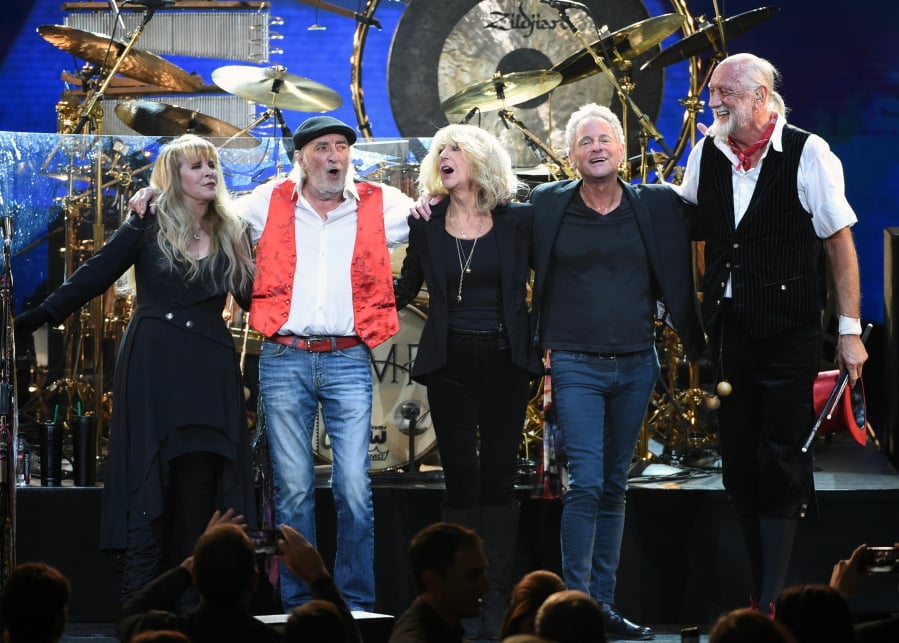 FILe - In this Jan. 26, 2018 file photo, Fleetwood Mac band members, from left, Stevie Nicks, John McVie, Christine McVie, Lindsey Buckingham and Mick Fleetwood appear at the 2018 MusiCares Person of the Year tribute honoring Fleetwood Mac in New York. The band said in a statement Monday that Buckingham is out of the band for its upcoming tour. Buckingham left the group once before, from 1987 to 1996. He’ll be jointly replaced by Neil Finn of Crowded House and Mike Campbell of Tom Petty and the Heartbreakers.