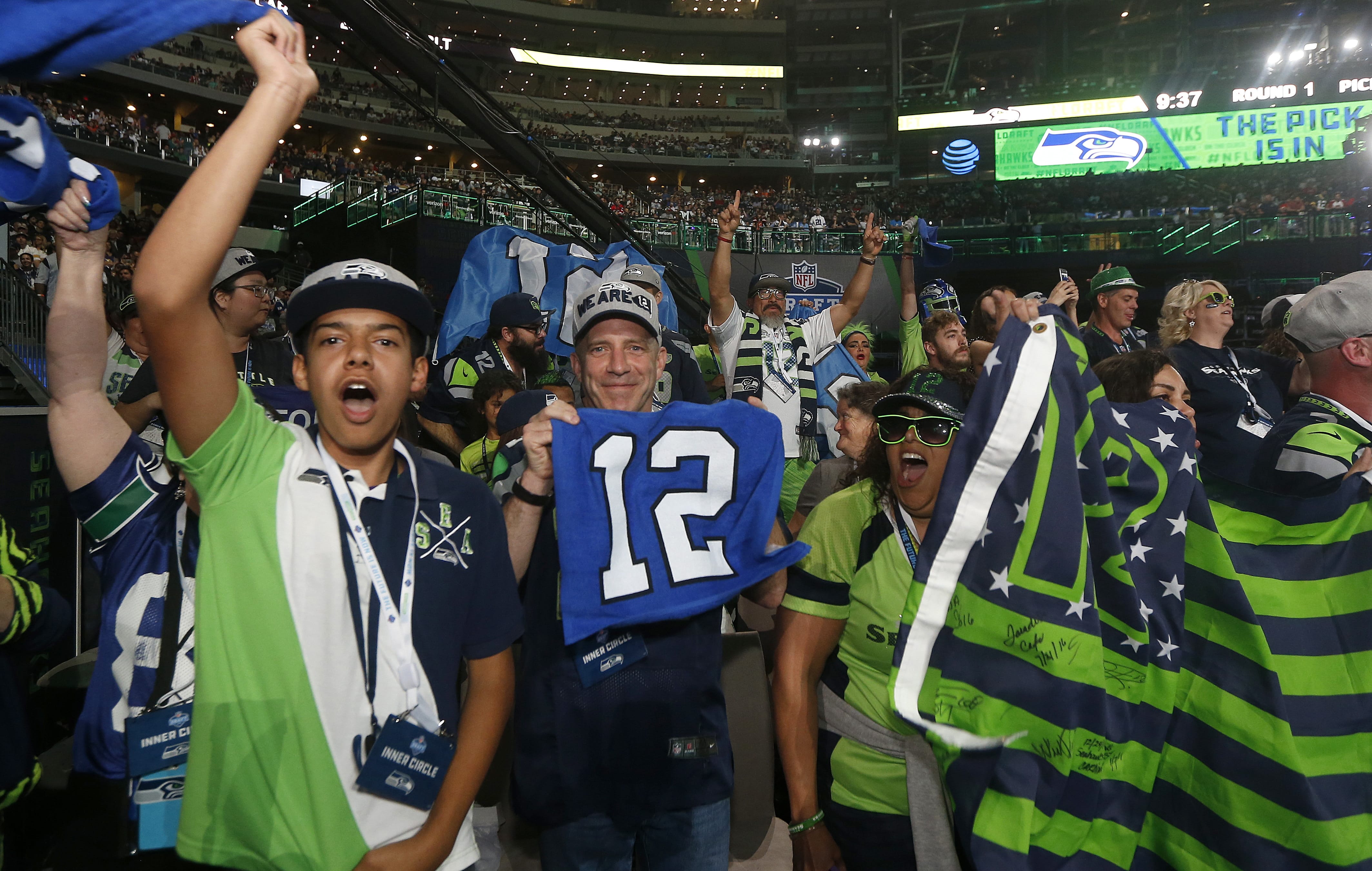 Seattle Seahawks fans cheer during the first round of the NFL football draft, Thursday, April 26, 2018, in Arlington, Texas.