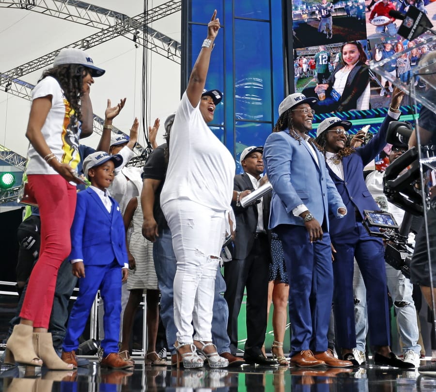 The family members of Shaquem Griffin take the stage during the NFL football draft in Arlington, Texas, Saturday, April 28, 2018. The Seahawks selected Shaquem in the fourth round. (Jae S.