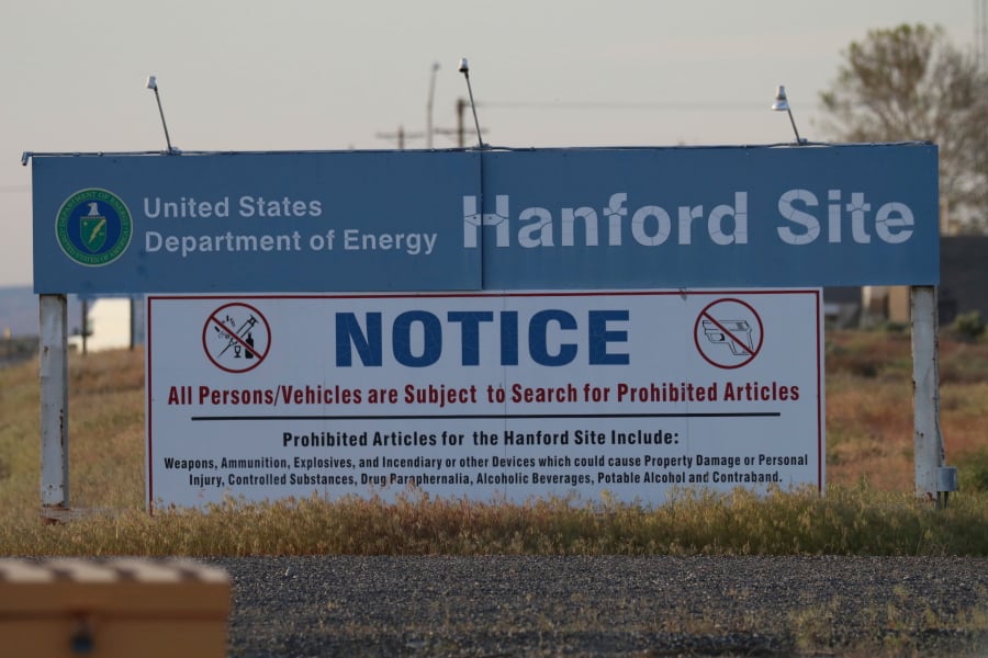 FILE - In this May 9, 2017, file photo, signs are posted near the entrance to the Hanford Nuclear Reservation in Richland, Wash. Federal investigators say problems first identified six years ago continue to plague the multi-billion-dollar Hanford vitrification plant that would be used to treat some of the nation’s deadliest nuclear waste.