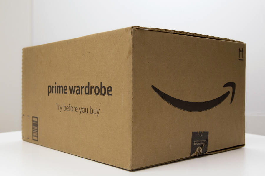 In this April 12, 2018 photo, A Prime Wardrobe box is displayed in New York. Amazon hopes to turn your home into a fitting room, after shipping you a box of fashions to try on before paying. It sounds a lot like Stitch Fix, Trunk Club or other services that send clothing in a box. But there are differences: There are no stylists with Prime Wardrobe, so you’ll have to pick out your own shirts or skirts. It’s not a subscription, so there’s no monthly commitment or additional fees, although you need to be a Prime member.
