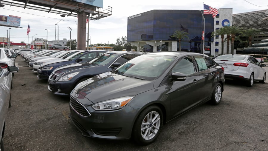 Certified pre-owned vehicles sit on display at a dealership in Miami.