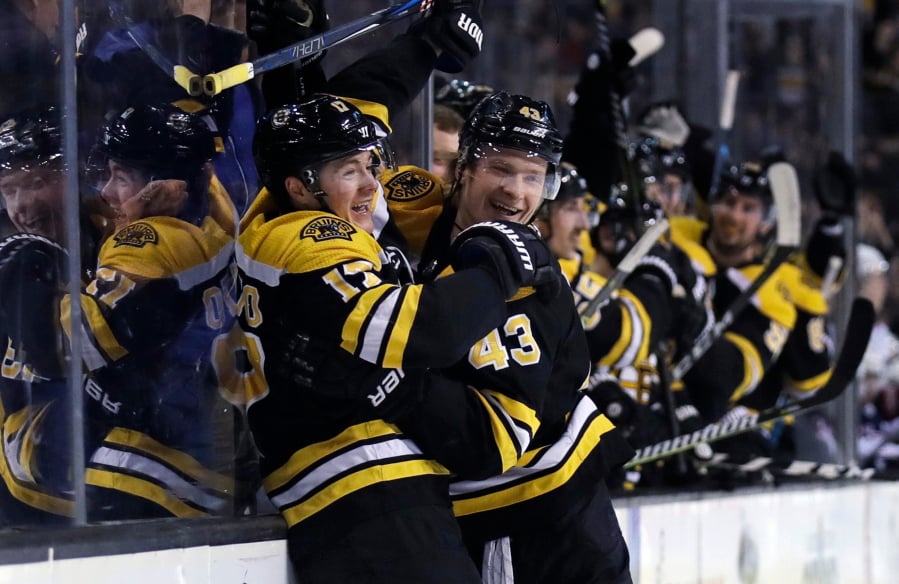 Boston Bruins forward Ryan Donato, left, and Danton Heinen (43).
