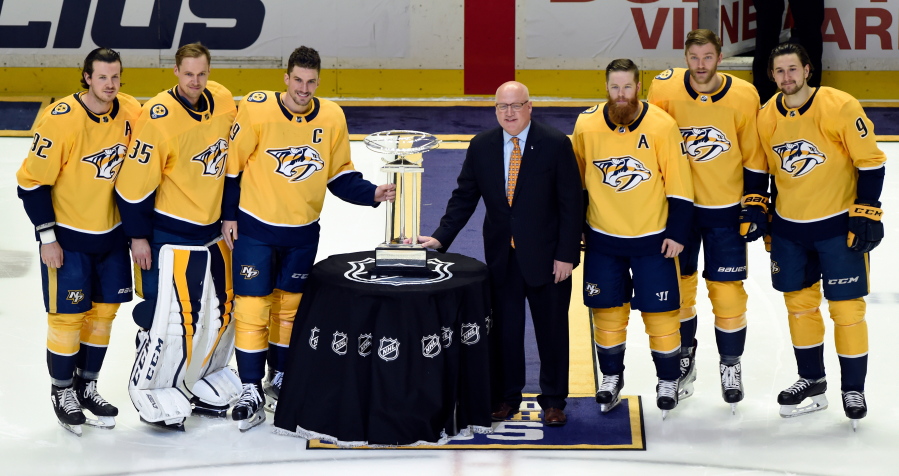 The changing of the guard begins at the top, where Nashville clinched its first Central Division title by running away with the league’s best record. Members of the team pose with the President’s Cup.