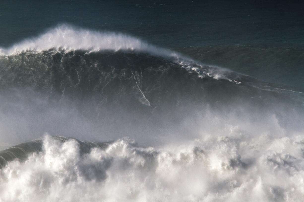 Brazilian surfer Rodrigo Koxa rides what has been judged the biggest wave ever surfed, at the Praia do Norte, or North beach, in Nazare, Portugal. On Saturday, April 28 2018, the World Surf League credited Koxa with a world record for riding the biggest wave ever surfed and said that its judging panel determined the wave was 80 feet (24.38 meters).