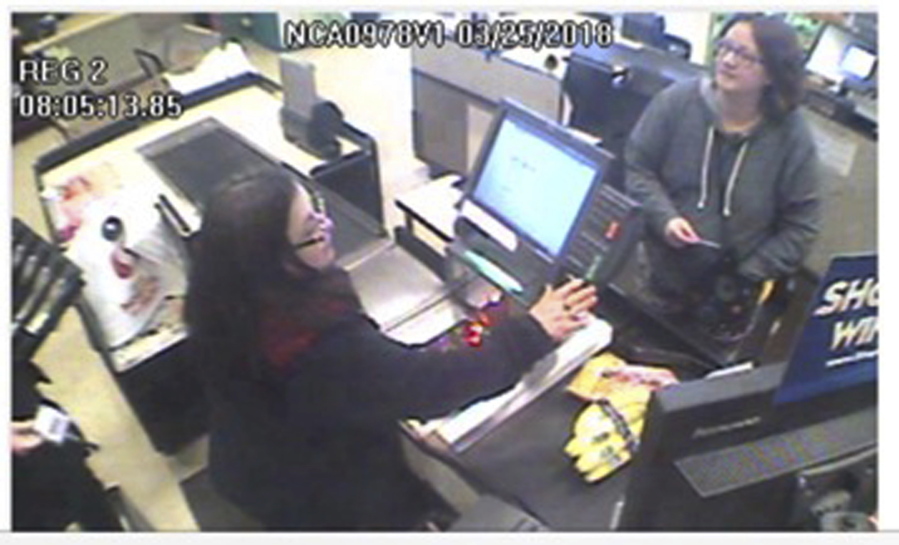 Jennifer Hart, right, is seen on surveillance video at a Safeway store March 25 in Fort Bragg, Calif. Sarah and Jennifer Hart of Woodland were found dead at a crash scene March 26, along with three of their children, where the SUV they were traveling in plunged off a coastal cliff near Mendocino, Calif.