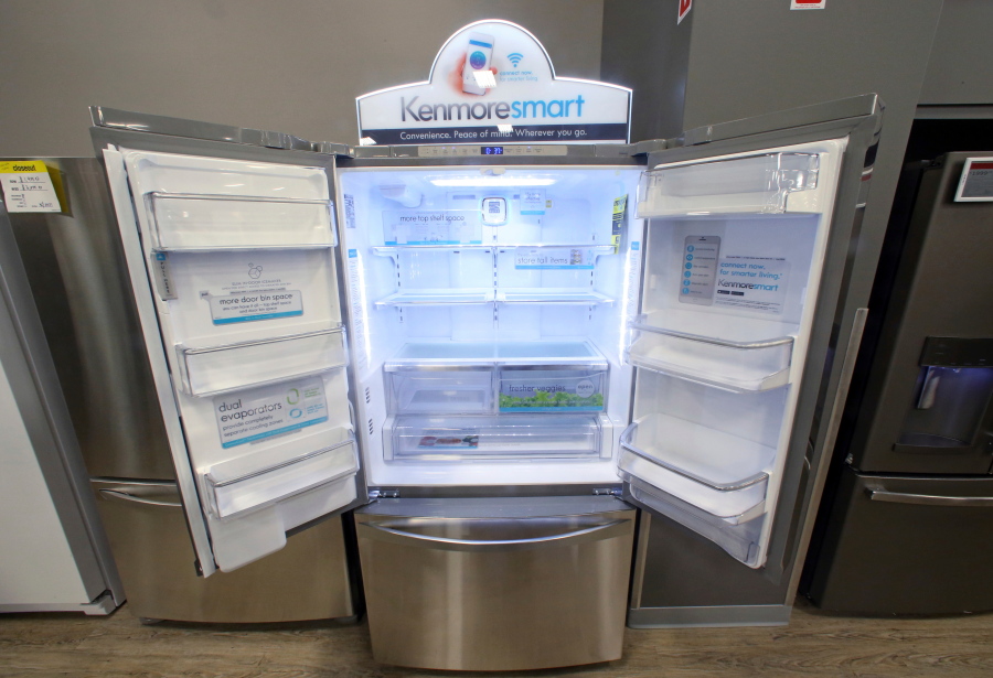 FILE - In this July 20, 2017, file photo, the Kenmore Elite Smart French Door Refrigerator appears on display at a Sears store in West Jordan, Utah. Private equity firm ESL Investments is offering to buy struggling Sear’s Kenmore brand and home improvement unit.