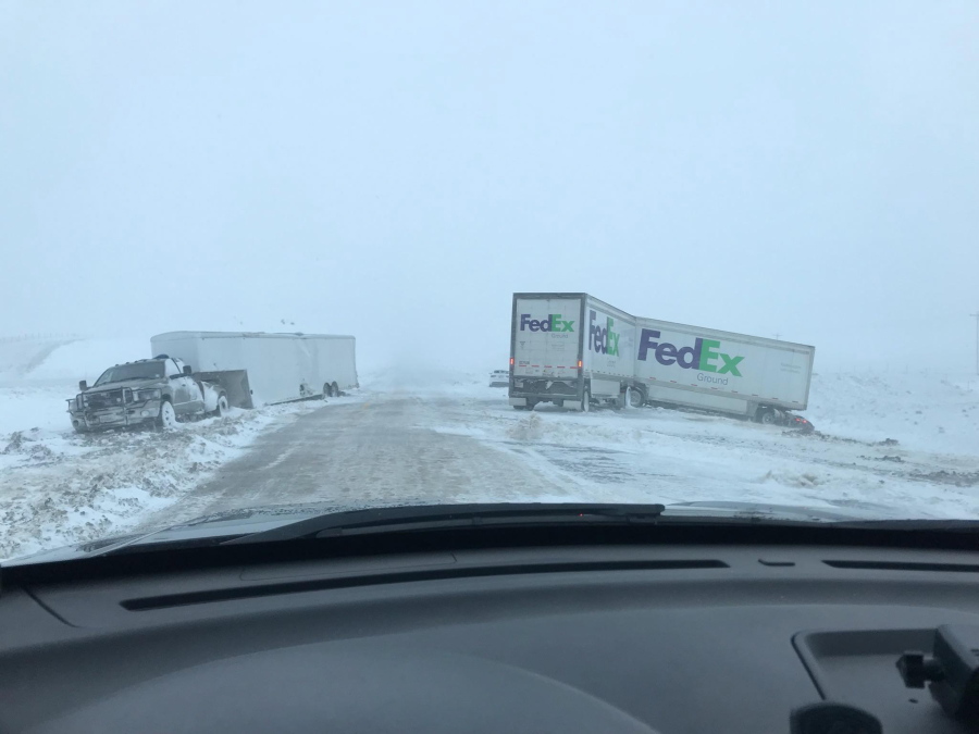 This photo provided by Nebraska State Patrol show stranded motorists including several trucks on Interstate 80 near Sidney, Neb., Friday, April 13, 2018. A potent spring storm system that's expected to persist through the weekend raked across the Midwest.