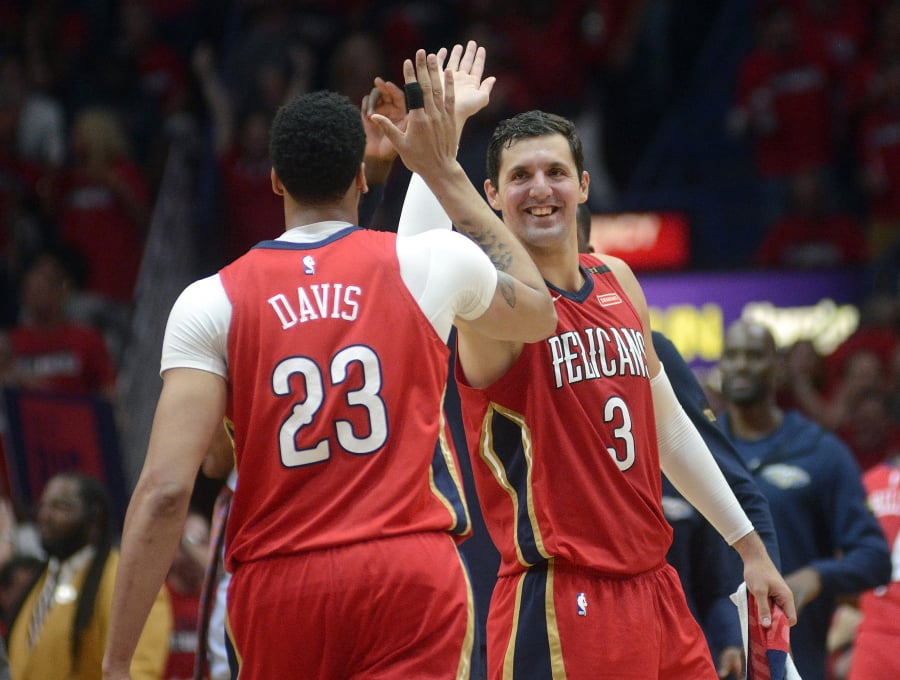 New Orleans Pelicans forward Nikola Mirotic (3) celebrates with forward Anthony Davis (23) during the first half of Game 3 of a first-round NBA basketball playoff series against the Portland Trail Blazers in New Orleans, Thursday, April 19, 2018.