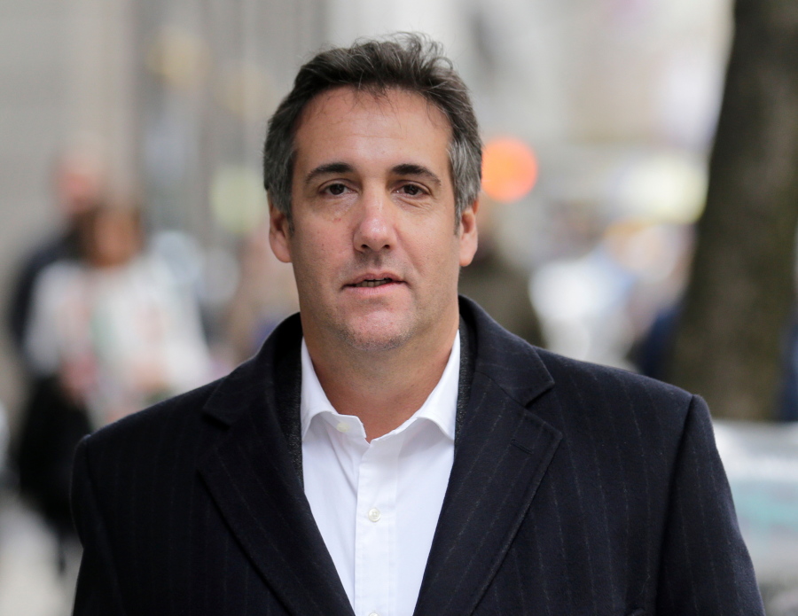 Michael Cohen, President Donald Trump’s personal attorney, walks along a sidewalk in New York. The company that publishes the National Enquirer paid a former doorman at one of Trump’s New York skyscrapers $30,000 during the presidential campaign for a tip about Trump it never ran. Dino Sajudin signed a contract with American Media Inc. that barred him from discussing his tip with anyone. Cohen acknowledged to the AP that he had discussed Sajudin’s story with the magazine when the tabloid was working on it. He said he was acting as a Trump spokesman when he did so and denied knowing anything beforehand about the Enquirer payment to the ex-doorman.