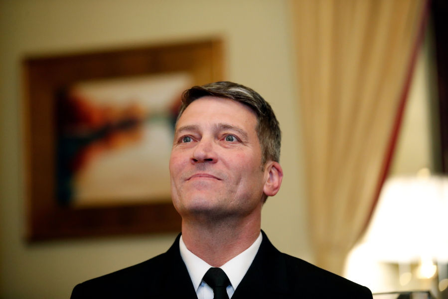 U.S. Navy Rear Adm. Ronny Jackson, M.D., sits with Sen. Johnny Isakson, R-Ga., chairman of the Veteran’s Affairs Committee, before their meeting on Capitol Hill in Washington.