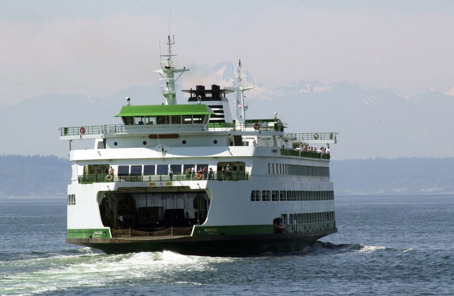 A ferry leaves Colman Dock in Seattle.