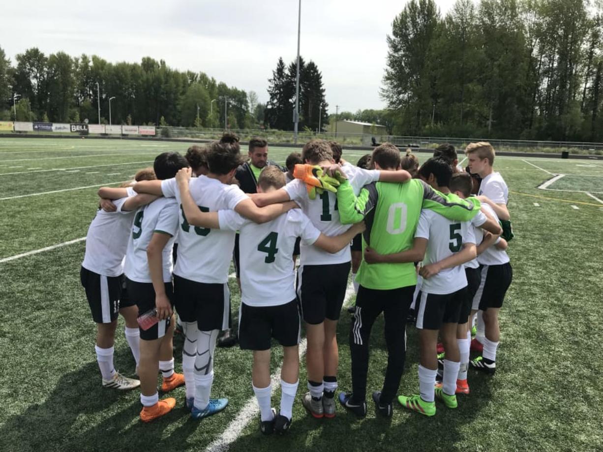 The Woodland soccer team huddles up. The Beavers defeated Tumwater 1-0 on Saturday, May 5, 2018, to advance in the 2A district tournament.