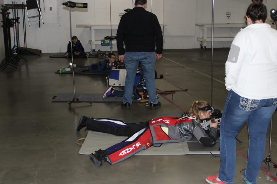 Kylie Delaney, 15, receives instruction at the firing range from shooting coach Katelyn Woltersdorf (right). Delaney recently competed in the Junior Olympics in Colorado Springs, Colorado.