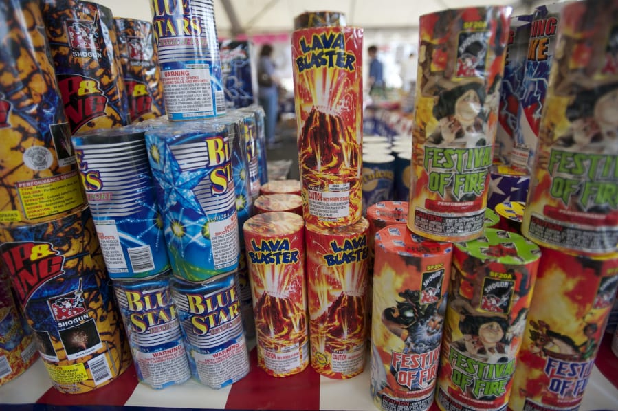 People browse the aisles at a fireworks stand benefiting the Brush Prairie Baptist Church Revolution Student Center at NE 63rd Street and NE Andresen Road on Sunday July 1, 2012.