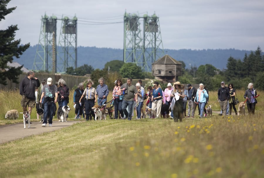 Visitors take part in a “Bark Ranger” walking tour last year at Fort Vancouver. This year’s four-walk series begins on Saturday.