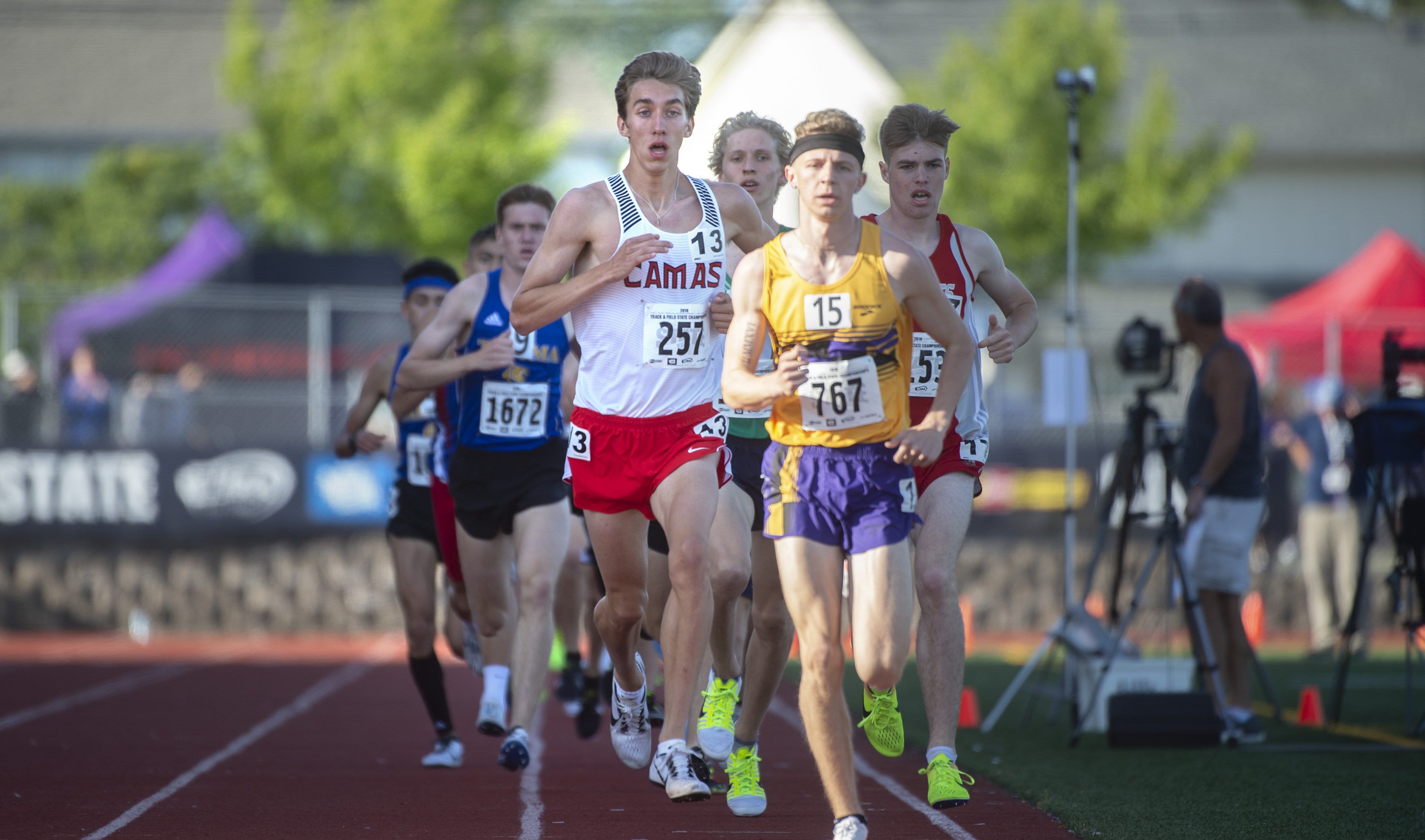 Camas' Daniel Maton (13) follows Issaquah's Luke George early in the 3A boys 1600-meter final on the opening day of the state track meet at Mt.