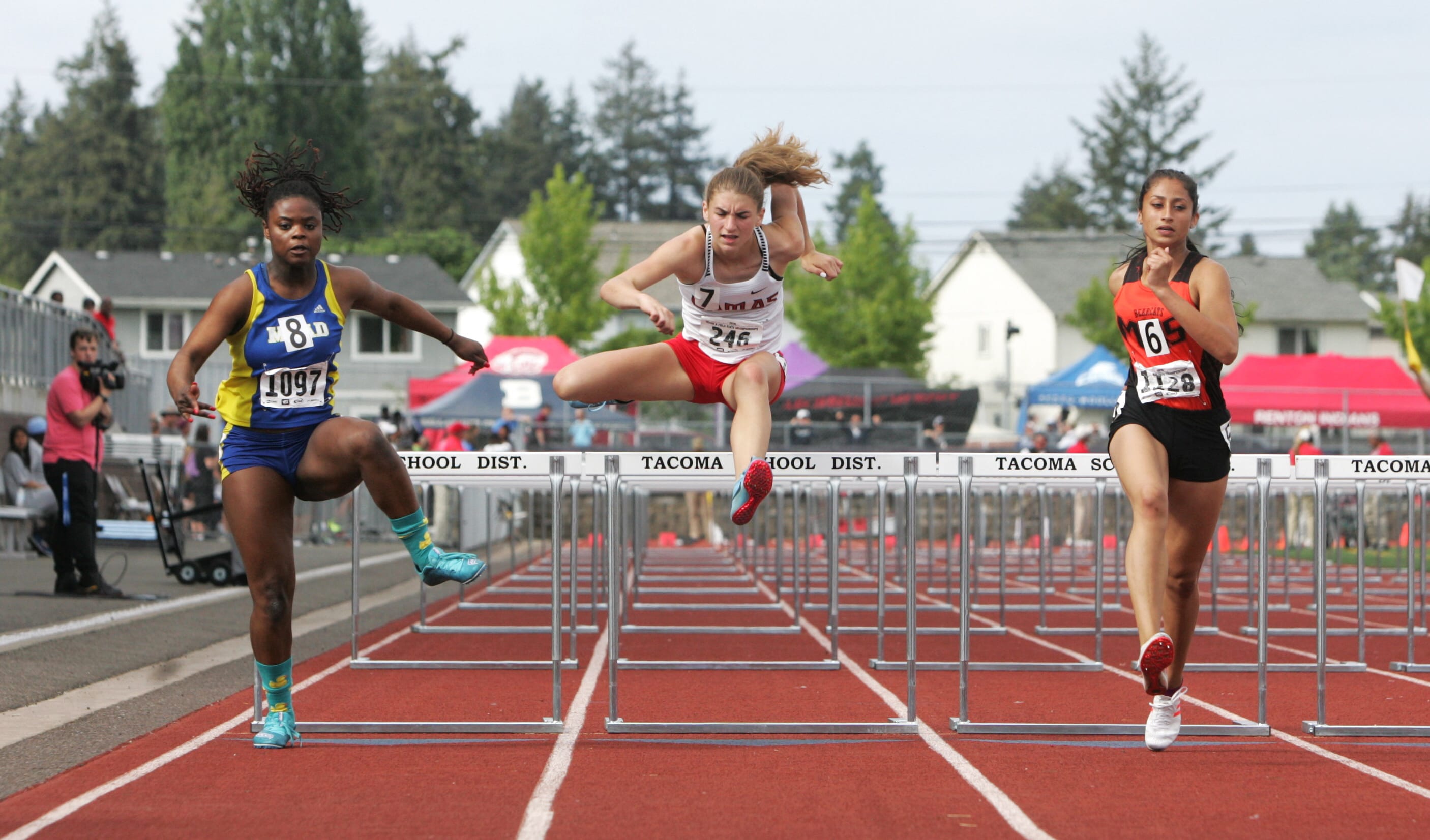 Camas freshman Lucy George, center, placed sixth in the 4A state 100-meter hurdles with a time of 14.72 seconds on Friday. (Dean J.