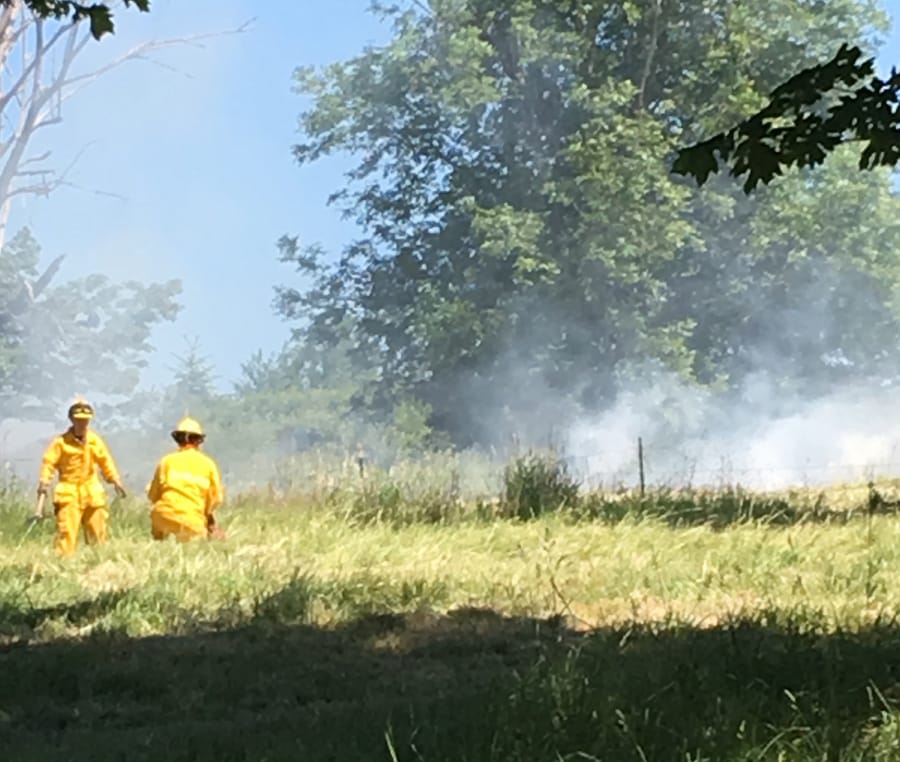 Crews from three agencies battled a grass fire at 22015 N.W. Cornell Drive, south of Ridgefield, on Sunday. Firefighters suggest people check recent burn piles to make sure they cannot rekindle.