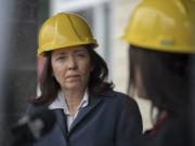 U.S. Sen. Maria Cantwell, D.-Wash., left, listens as Alishia Topper of the Vancouver City Council speaks on the topic of affordable housing at Meriwether Place at the end of March 30.
