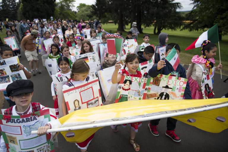 Sarah J Anderson Elementary School marches together during the Children's Cultural Parade at Fort Vancouver National Historic Site on Friday, May 11, 2018.  The National Park Service, the Evergreen School District, and the Vancouver School District came together for the annual event to support local students and celebrate the region's historical diversity.
